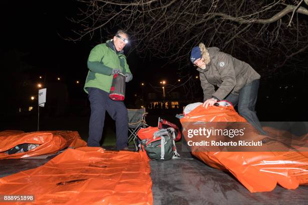 Two people prepare their beds in the garden during Sleep In The Park, a Mass Sleepout organised by Scottish social enterprise Social Bite to end...