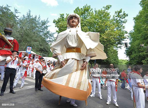 Performer in a giant costume dances through the streets of Pamplona during the 2nd day of the San Fermin running of the bulls fiesta on July 08, 2009...