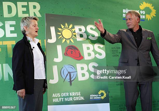 German Greens party lead elections candidates Juergen Trittin and Renate Kuenast speak during the campaign for the next federal elections in...