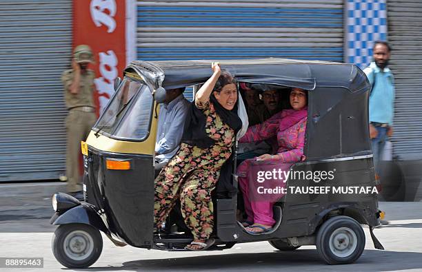 Kashmiri Muslim women shout slogans during the funeral of Muslim youth Assrar Mushtaq in Srinagar on July 8, 2009. Protesters in Indian Kashmir set...