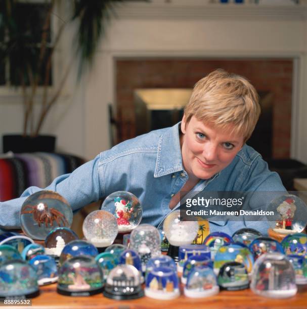 American actress and comedian Alison Arngrim with a collection of snowglobes, circa 1996.