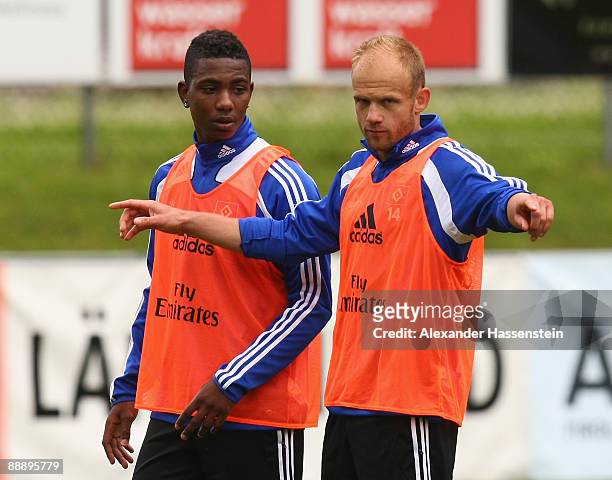 David Jarolim talks to his team mate Eljero Elia during a training session at day three of the Hamburger SV training camp on July 8, 2009 in...
