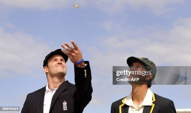 England captain Andrew Strauss tosses the coin with his Australian counterpart Ricky Ponting on the first day of the first Ashes Test match in...