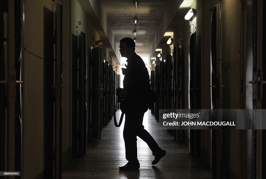 A visitor makes his way down a corridor