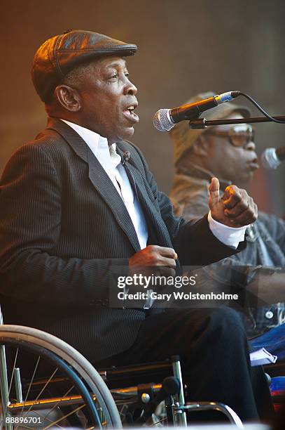 Staff Benda Bilili perform on stage on the third day of Eurockneennes Festival at Malsaucy on July 5, 2009 in Belfort, France.