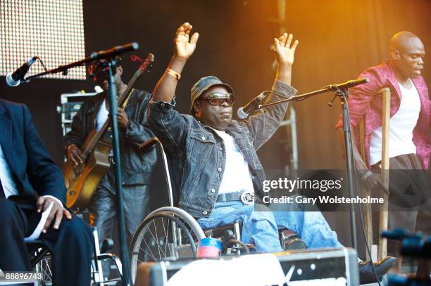 Staff Benda Bilili perform on stage on the third day of Eurockneennes Festival at Malsaucy on July 5, 2009 in Belfort, France.