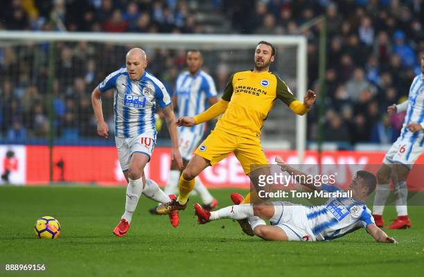 Jonathan Hogg of Huddersfield Town tackles Glenn Murray of Brighton and Hove Albion during the Premier League match between Huddersfield Town and...