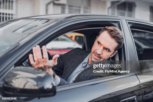 enojarse en el coche del empresario - impatient fotografías e imágenes de stock