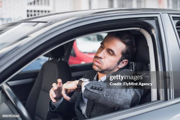 geschäftsmann ungeduldig im auto - impatience flowers stock-fotos und bilder