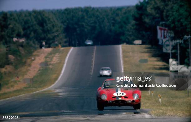 The Le Mans 24 Hours; Le Mans, June 23-24, 1962. The Ferrari 250GTO driven by Jean Guichet and Pierre Noblet brakes for Mulsanne Corner. They would...