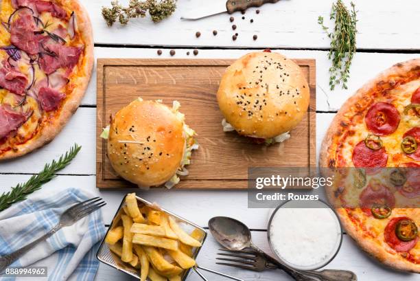 close up of fast food on table - burger and fries stock pictures, royalty-free photos & images