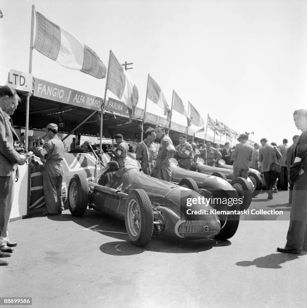 The British Grand Prix; Silverstone, May 13, 1950. The Alfa Romeo team cars lined up in front of the temporary pits, which were then located between...