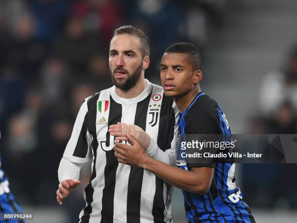 Dalbert Henrique Chagas Estevão of FC Internazionale and Gonzalo Higuain of Juventus FC compete during the Serie A match between Juventus and FC...