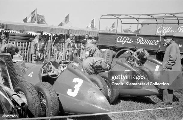 The British Grand Prix; Silverstone, May 13, 1950. The Alfa team cars in the paddock before the start. These are the cars of Luigi Fagioli,'Nino'...