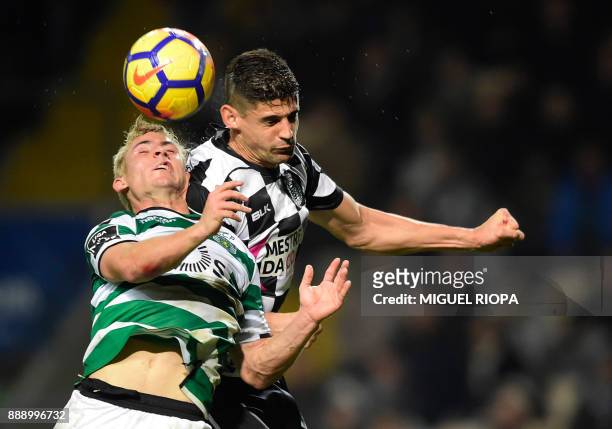 Sporting's Portuguese forward Daniel Podence vies with Boavista's Italian defender Raphael Rossi during the Portuguese league football match between...