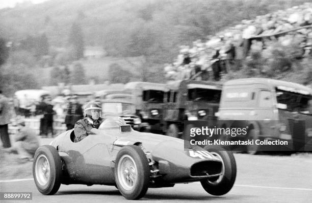 The Belgian Grand Prix; Spa-Francorchamps, June 5, 1955. Mike Hawthorn lifts a front wheel of his Vanwall as he crests Raidillon. This was Vanwall's...