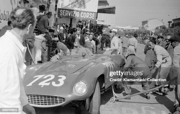 The Mille Miglia; May 1, 1955. Pit stop for the Ferrari 121LM of leader Eugenio Castellotti at Revenna. Castellotti is smoking a cigarette behind the...