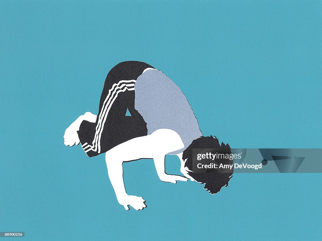 Man balancing in crane pose