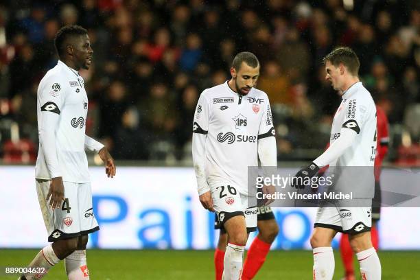 Papy Djilobodji, Fouad Chafik and Benjamin Jeannot of Dijon look dejected during the Ligue 1 match between EA Guingamp and Dijon FCO at Stade du...