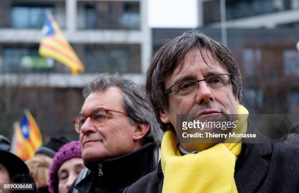 Ousted Catalan leader Carles Puigdemont listens to speeches during a pro-Catalan supporters during a demonstration in the EU quarter. Thousands of...