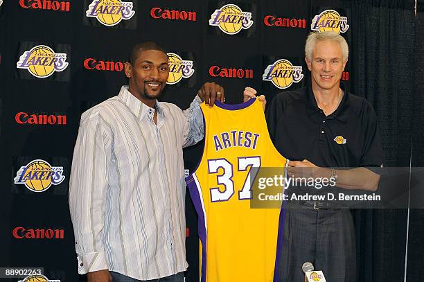 Ron Artest and Mitch Kupchak General Manager the Los Angeles Lakers unveil his jersey during a press conference on July 8, 2009 at the Toyota Sports...