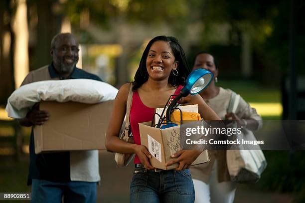 young woman moving in to dorm - dorm room stock-fotos und bilder