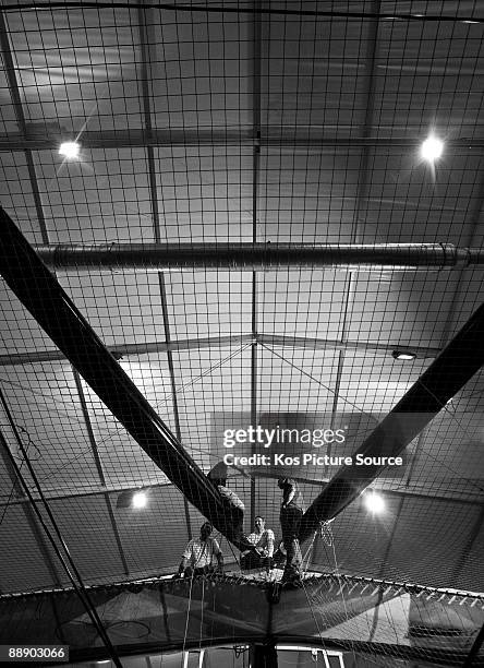 Engineers complete the carbon fibre crossbeams aboard the new 90ft radical designed Americas Cup yacht Alinghi 5 on June 24, 2009 in Villeneuve,...