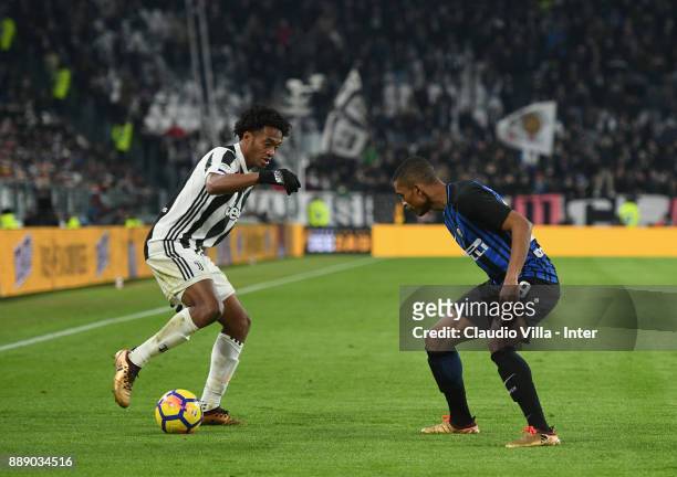 Dalbert Henrique Chagas Estevão of FC Internazionale and Juan Cuadrado of Juventus FC compete for the ball during the Serie A match between Juventus...