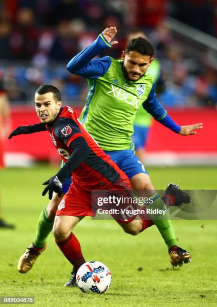 Sebastian Giovinco of Toronto FC is fouled by Christian Roldan of the Seattle Sounders during the first half of the 2017 MLS Cup Final at BMO Field...