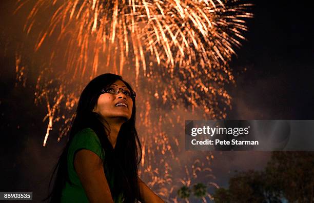 women watching pasadena, rose bowl fire works show - 4th of july fireworks stock pictures, royalty-free photos & images