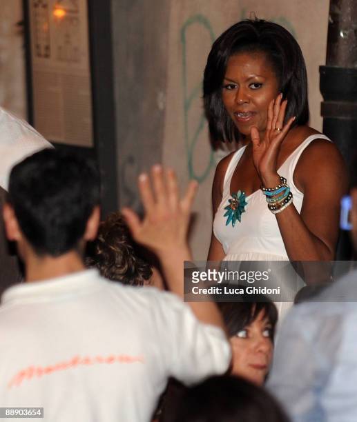 First Lady Michelle Obama leaves the Maccheroni restaurant on July 8, 2009 in Rome, Italy. The wives of the leaders attending the G8 summit have...