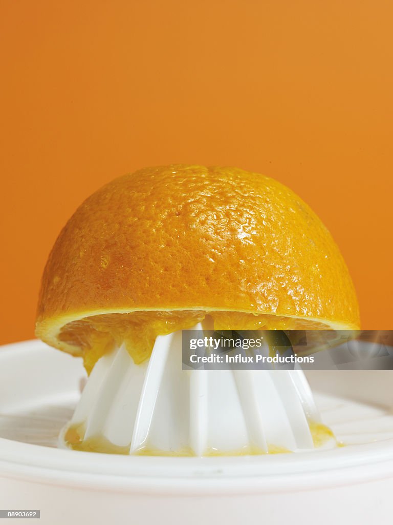 Orange on juicer