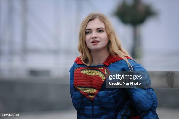 Young woman in a Superman costume is seen in Kiev, Ukraine on December 9, 2017.