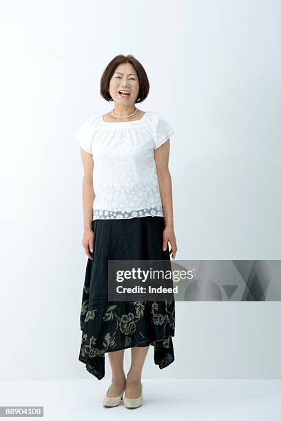 portrait of mature woman, full length - man portrait full body 50's stock-fotos und bilder