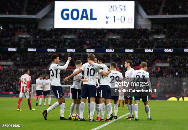 Heung-Min Son of Tottenham Hotspur celebrates his sides first goal with his team mates which came through a own goal by Ryan Shawcross of Stoke City...