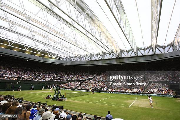 Russia Dinara Safina in action vs France Amelie Mauresmo during Women's 4th Round at All England Club. View of retractable roof over Centre Court....