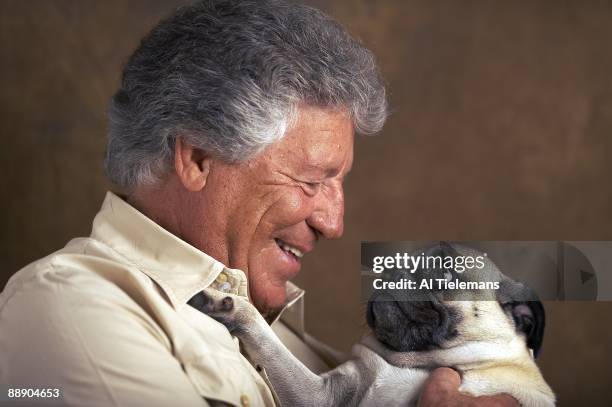 Where Are They Now: Closeup portrait of former driver Mario Andretti holding pug dog at his home Villa Montona. Nazareth, PA 5/13/2009 CREDIT: Al...