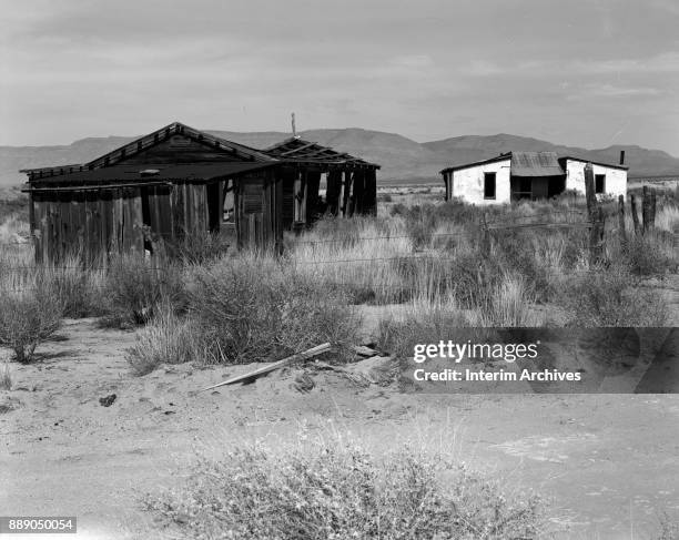 View of the remains of structures, including the McDonald ranch house, at the White Sands Missile Range, New Mexico, 1968. In 1945, the site had been...