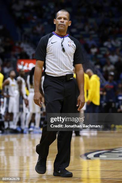 Referee Eric Lewis reacts during the second half of a game between the New Orleans Pelicans and the Denver Nuggets at the Smoothie King Center on...