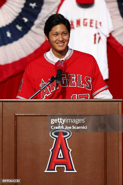 Shohei Ohtani speaks onstage as he is introduced to the Los Angeles Angels of Anaheim at Angel Stadium of Anaheim on December 9, 2017 in Anaheim,...