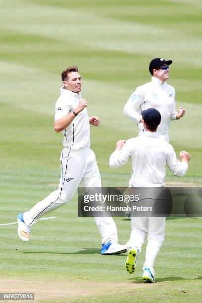 Tim Southee of New Zealand celebrates after claiming the wicket of Kieran Powell of the West Indies during day two of the Second Test Match between...