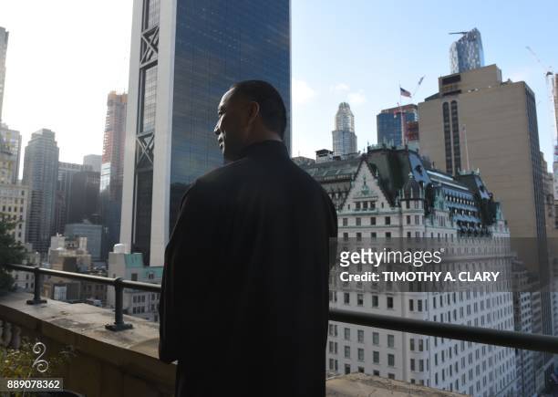 Billionaire Guo Wengui, who is seeking asylum in the United States after accusing officials in his native China of corruption, poses at his New York...