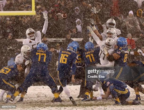 Bennett Moehring of the Navy Midshipmen attempts a field goal in the final seconds of the game but misses giving the win to the Army Black Knights on...