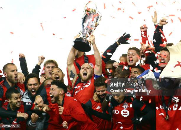 Michael Bradley of Toronto FC lifts the Championship Trophy after winning the 2017 MLS Cup Final against the Seattle Sounders at BMO Field on...