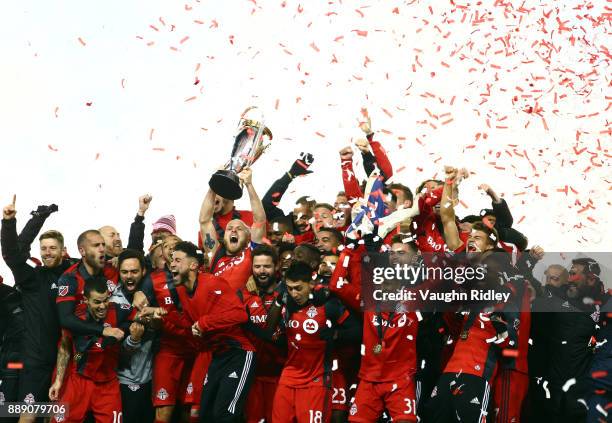 Michael Bradley of Toronto FC lifts the Championship Trophy after winning the 2017 MLS Cup Final against the Seattle Sounders at BMO Field on...