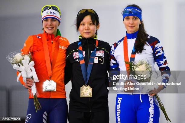 Marrit Leenstra of the Netherlands, Miho Takagi of Japan and Yekaterina Shikhova of Russia stand on the podium after the ladies 1500 meter race...