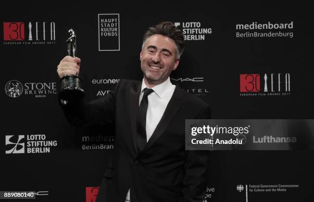 William Oldroyd poses with the prize European Discovery Prix Fipresci for the film Lady Macbeth at the photocall after the 30th European Films Awards...