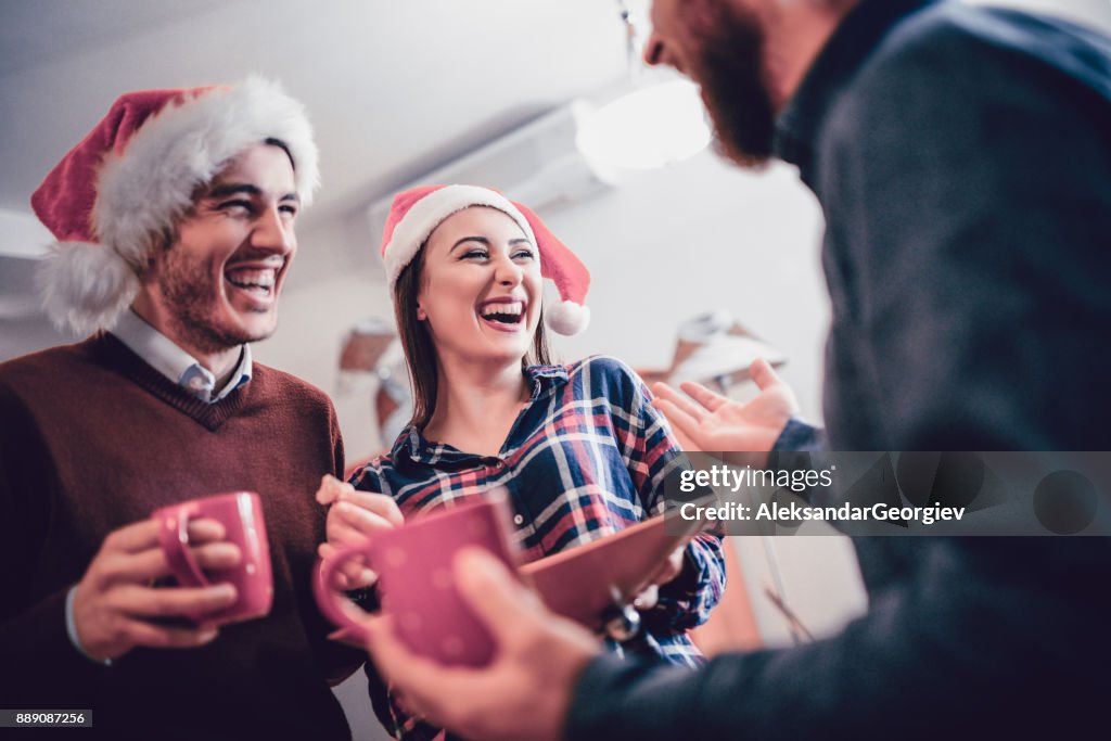 Smiling Group of Friends Drink Eggnog and Celebrate the Holidays Together
