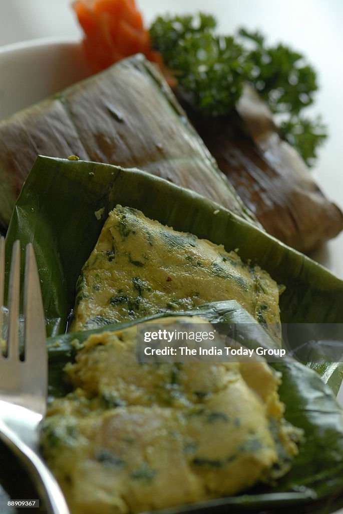 Paturi Chicken (Steamed Chicken with herbs and spices wrapped in Banana leaves and pan fried ) served at Oh Calcutta Restaurant in New Delhi, India (Food)