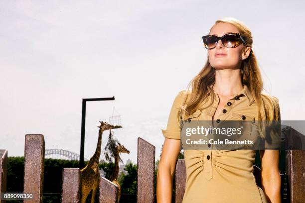 Paris Hilton backdropped by giraffes during a promotion visit to Australia to launch her 23rd fragrance, Rosé Rush at Taronga Zoo on December 1, 2017...